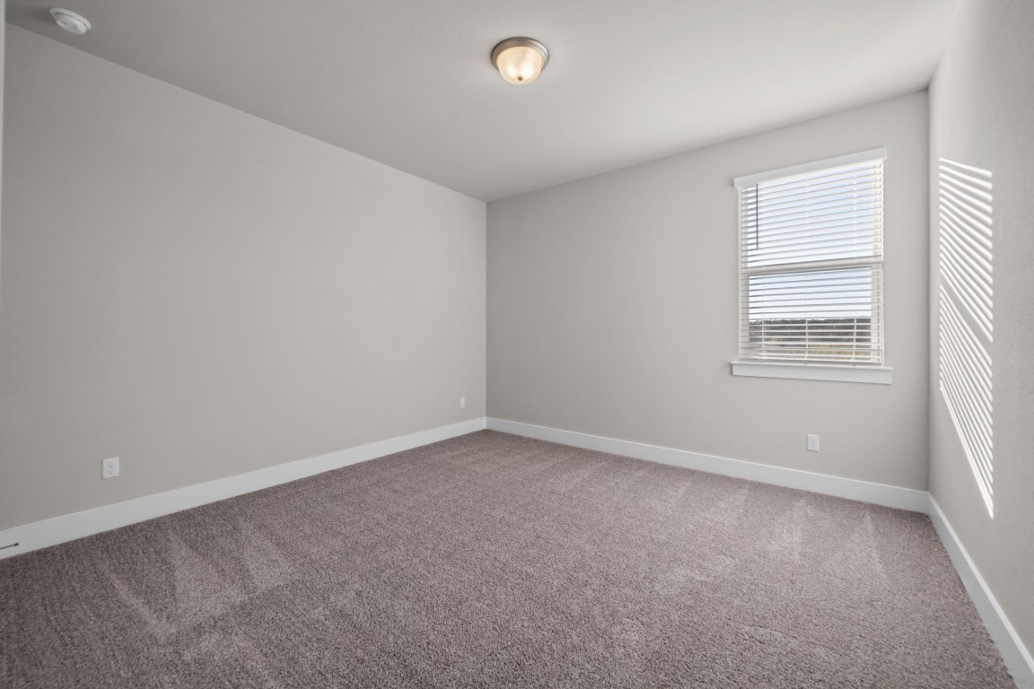 217 Pinnacle Lane Kyle, TX 78640 - Photo 25 of 33 an empty room with a window