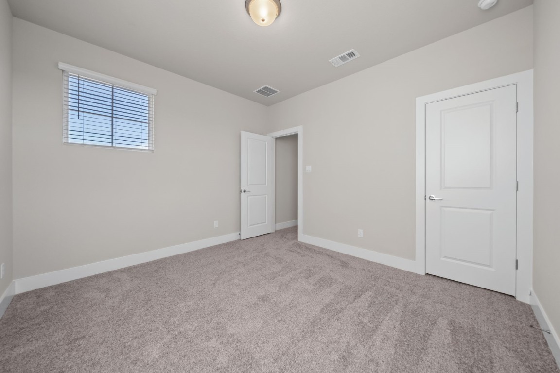 217 Pinnacle Lane Kyle, TX 78640 - Photo 30 of 33 a view of an empty room with a window