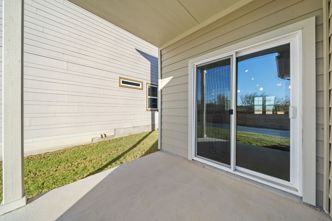 217 Pinnacle Lane Kyle, TX 78640 - Photo 33 of 33 a glass door with a yard