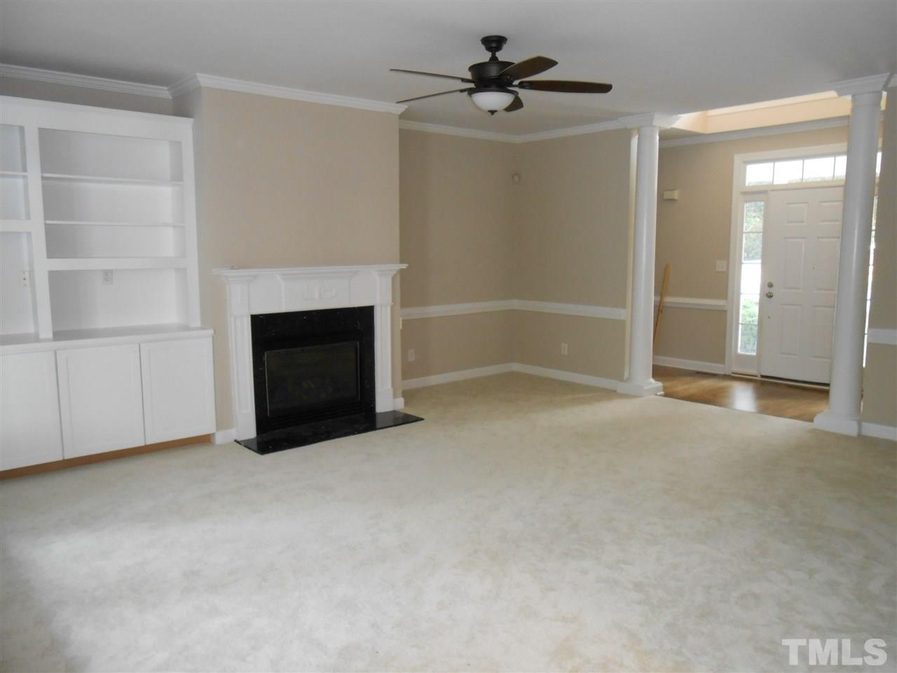 7900 Oneal Road Raleigh, NC 27613 - Photo 3 of 25 a view of empty room with a fireplace