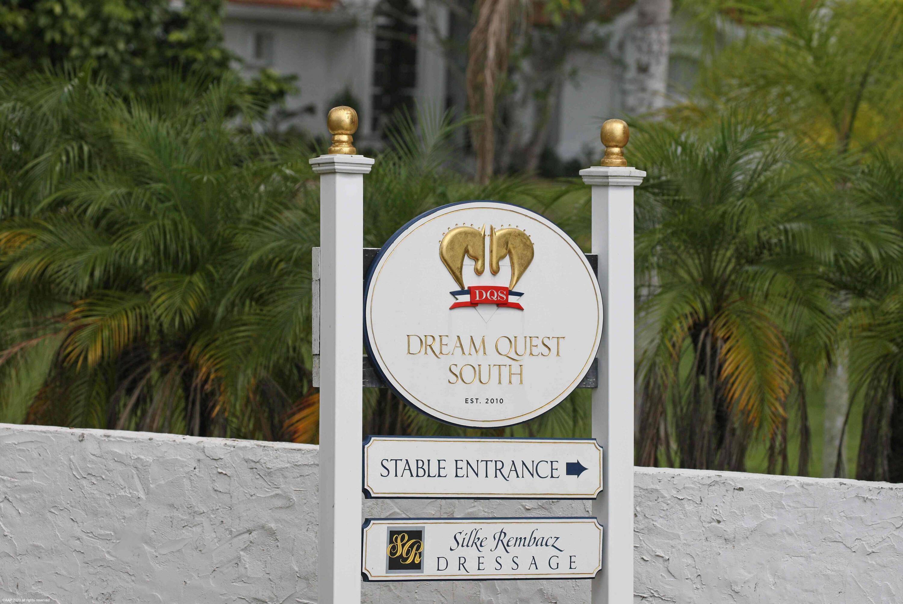 16559 Rustic Road Wellington, FL 33470 - Photo 12 of 82 a sign on the side of a building