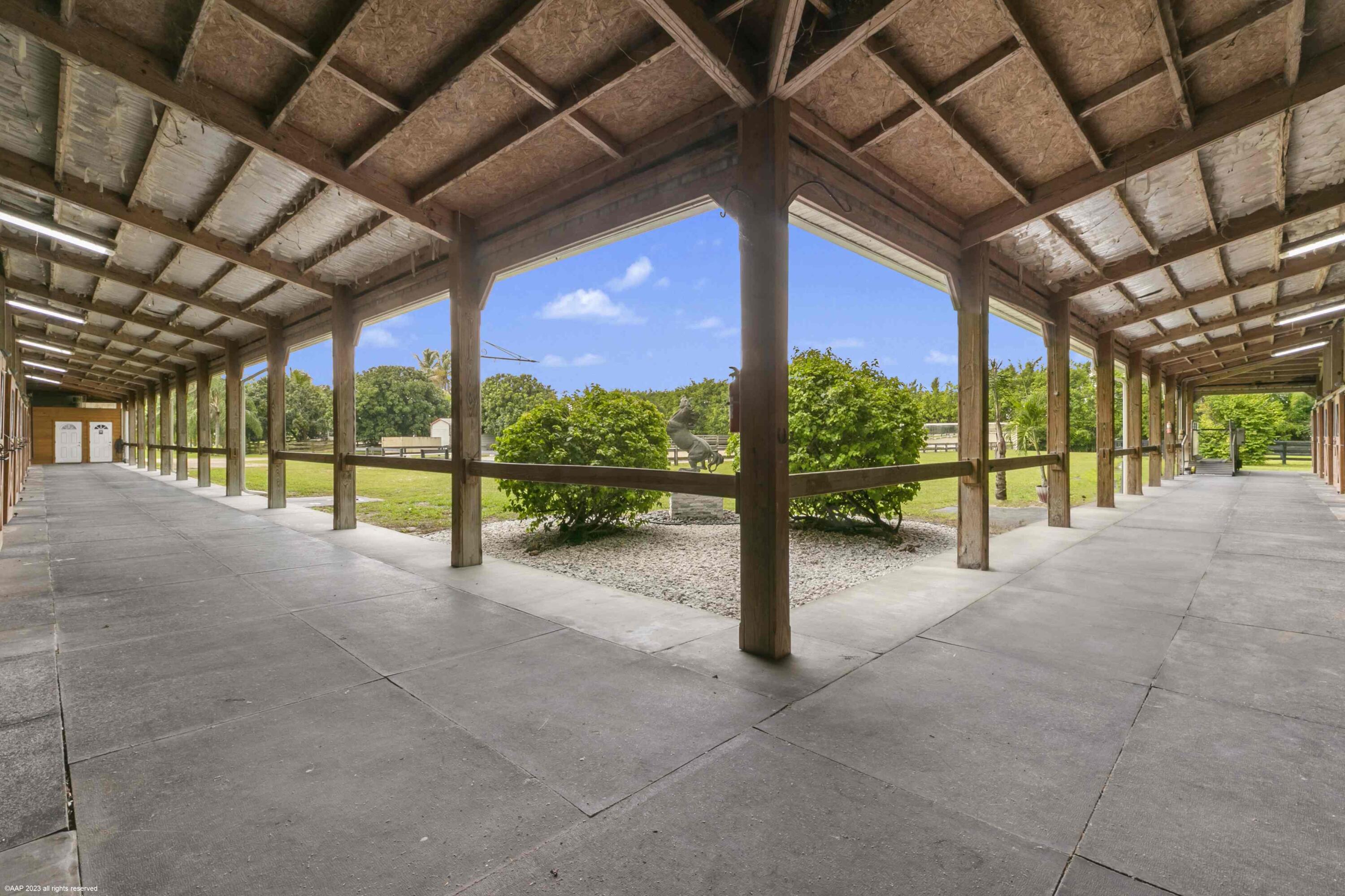 16559 Rustic Road Wellington, FL 33470 - Photo 13 of 82 a view of an empty room with a sliding door