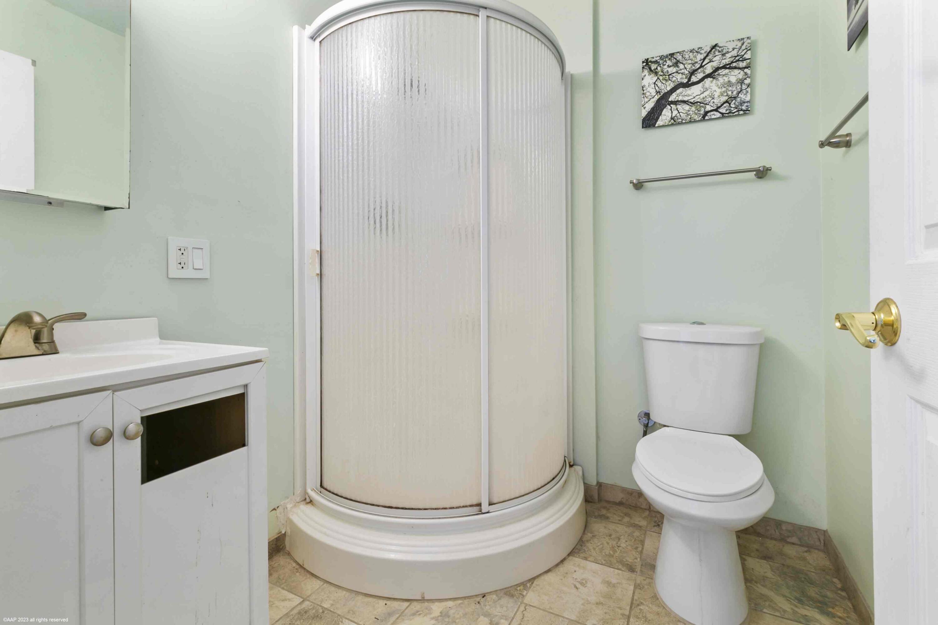 16559 Rustic Road Wellington, FL 33470 - Photo 25 of 82 a bathroom with a toilet and a sink
