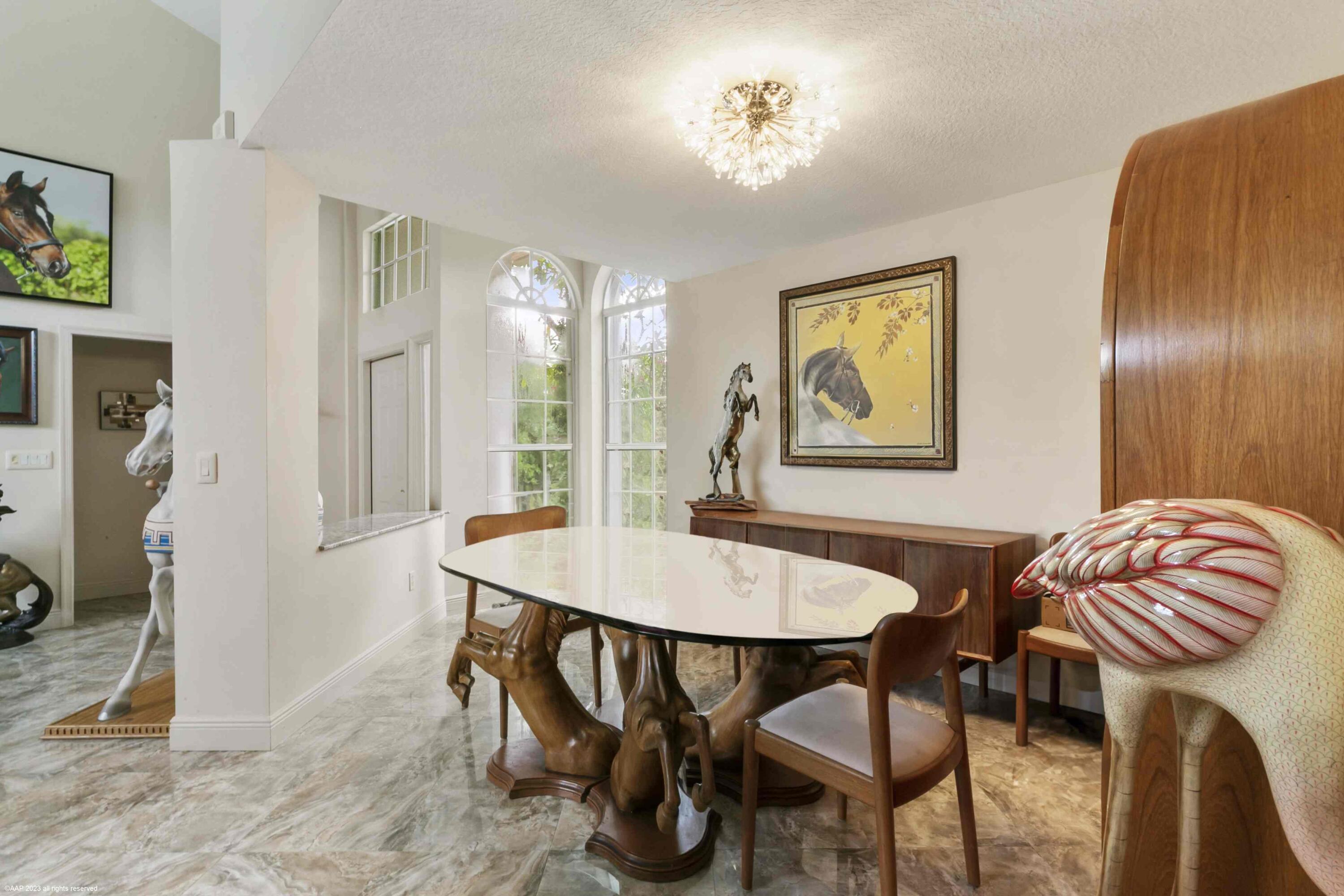 16559 Rustic Road Wellington, FL 33470 - Photo 45 of 82 a view of a dining room with furniture and wooden floor