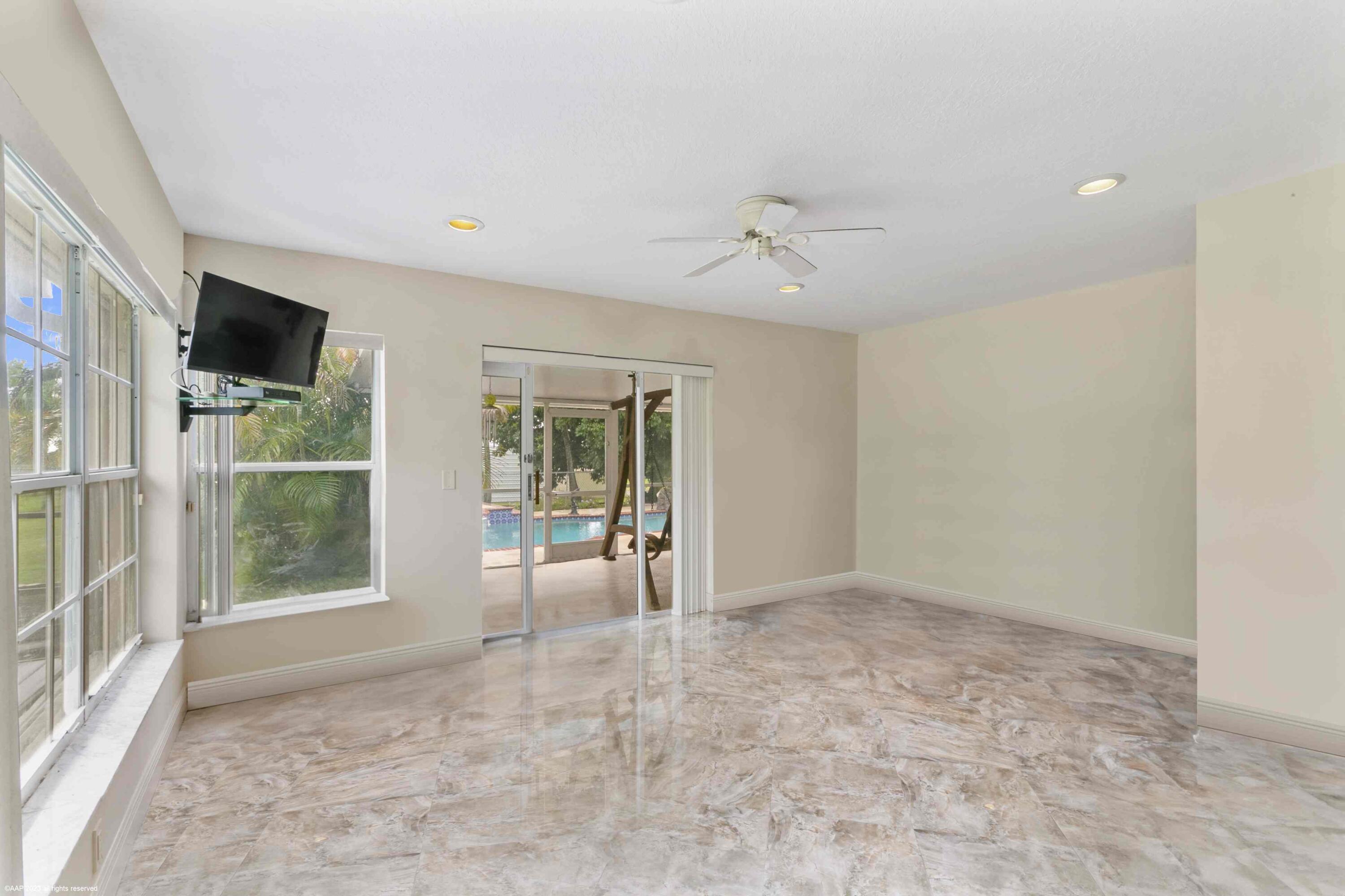 16559 Rustic Road Wellington, FL 33470 - Photo 51 of 82 a view of an empty room with a window