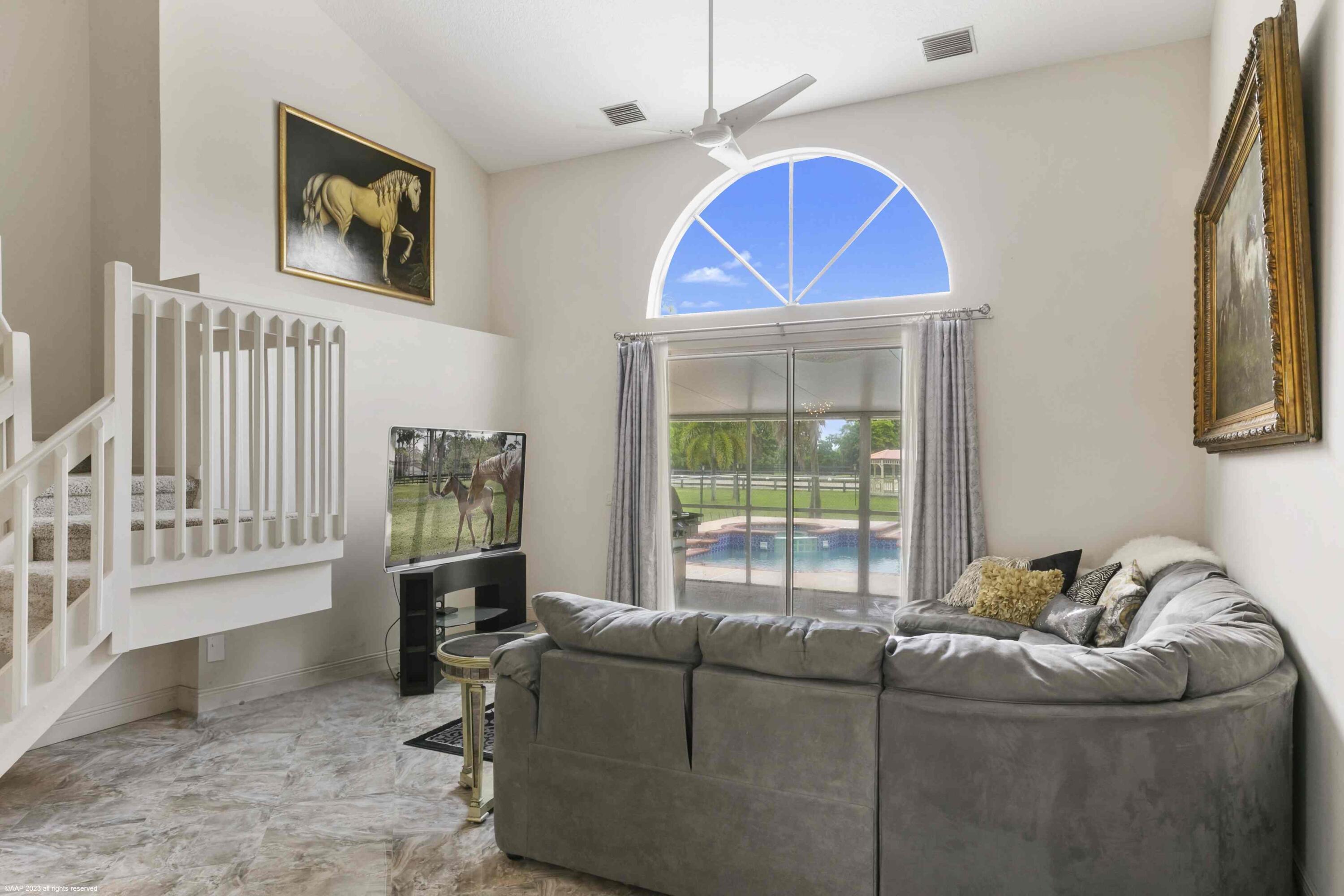 16559 Rustic Road Wellington, FL 33470 - Photo 54 of 82 a living room with furniture and a window