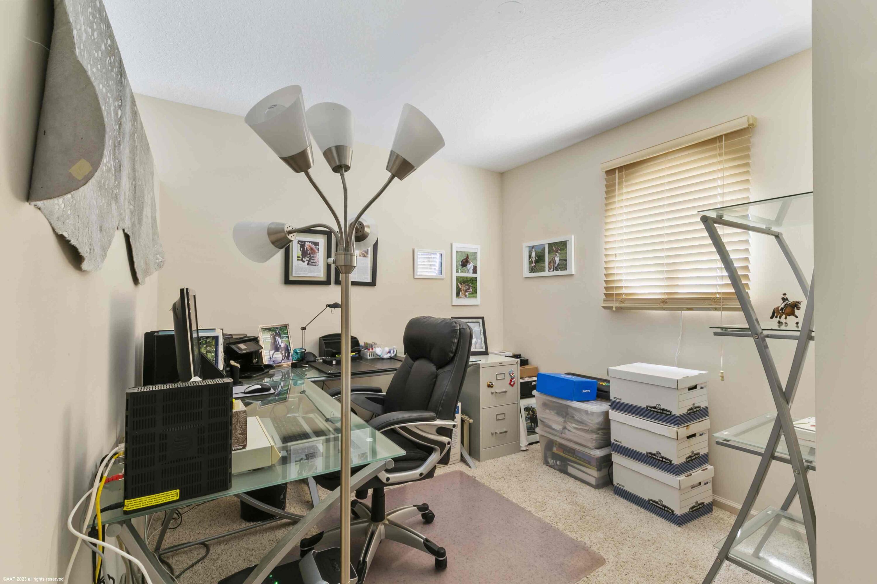16559 Rustic Road Wellington, FL 33470 - Photo 70 of 82 a work room with furniture and a window