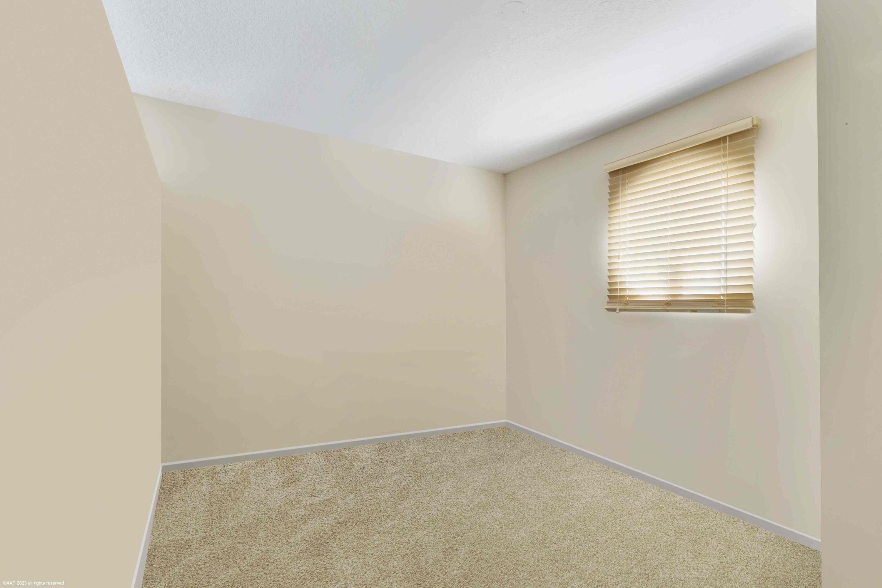 16559 Rustic Road Wellington, FL 33470 - Photo 71 of 82 an empty room with a window
