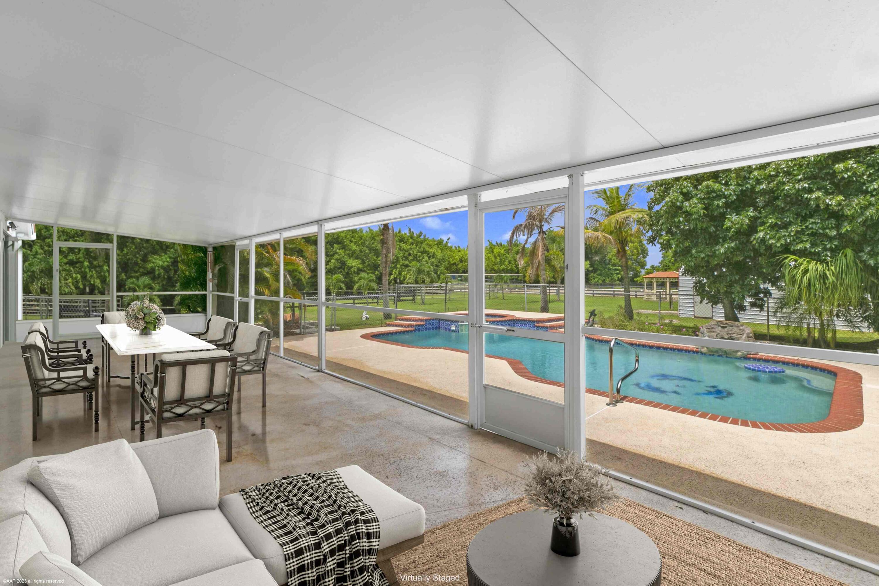 16559 Rustic Road Wellington, FL 33470 - Photo 75 of 82 a view of a living room and floor to ceiling window
