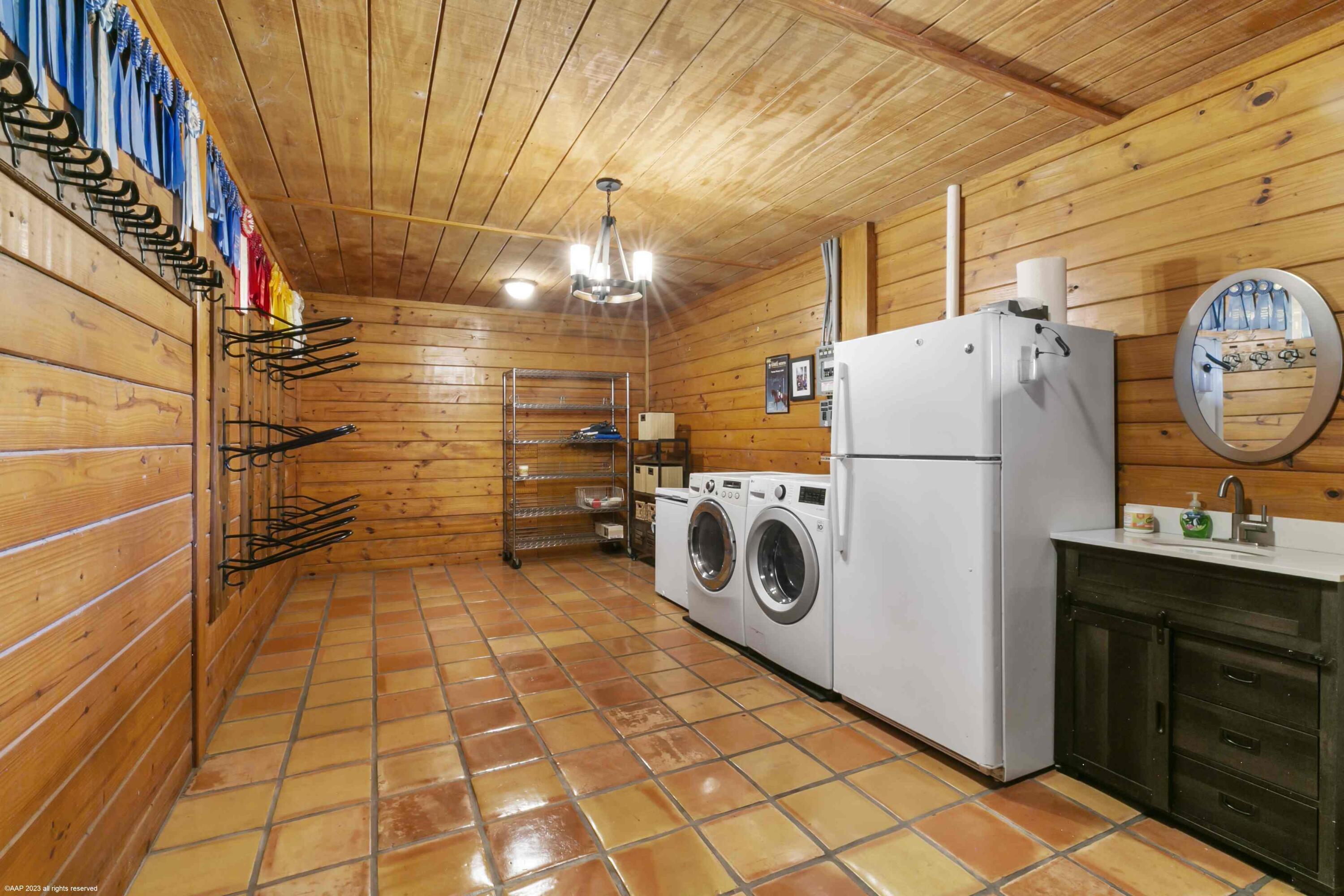 16559 Rustic Road Wellington, FL 33470 - Photo 9 of 82 a utility room with dryer and washer