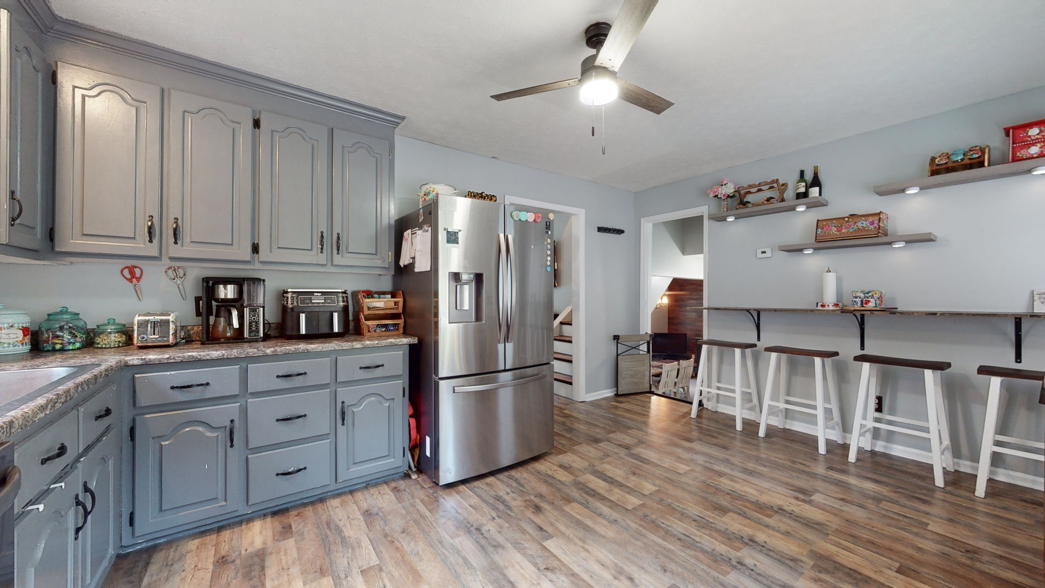 1014 Wildcat Road Dickson, TN 37055 - Photo 11 of 37 a kitchen with white cabinets and stainless steel appliances