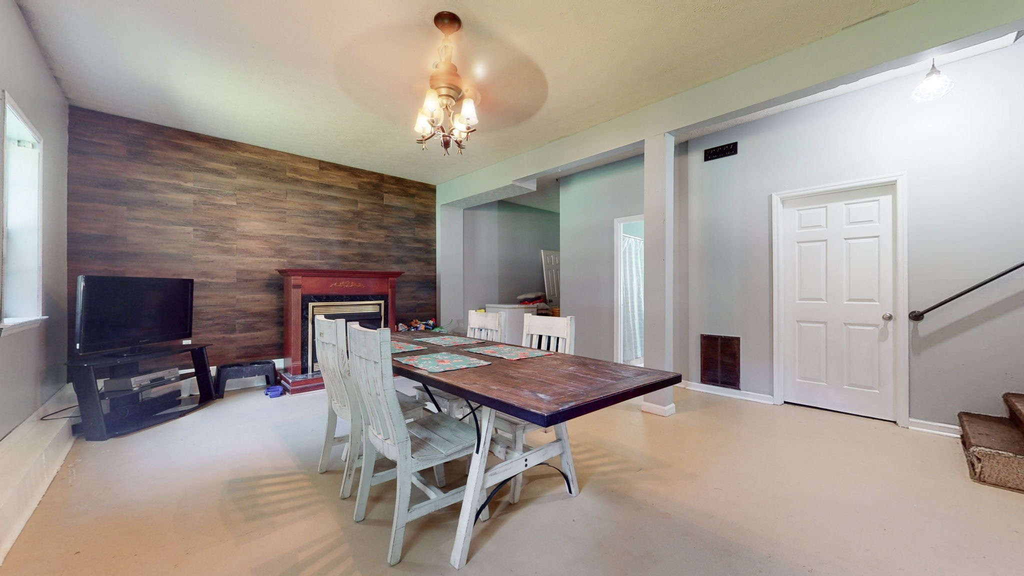 1014 Wildcat Road Dickson, TN 37055 - Photo 14 of 37 a view of a dining room with furniture and a chandelier