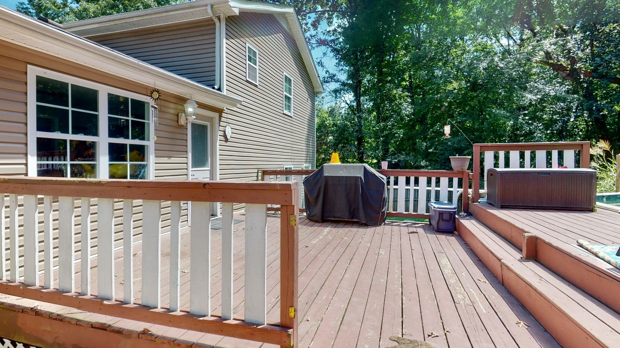 1014 Wildcat Road Dickson, TN 37055 - Photo 25 of 37 a view of a wooden deck with a bench