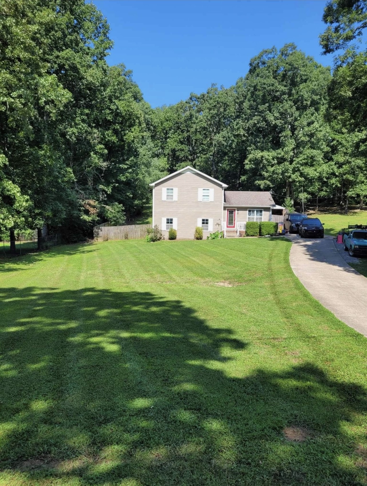 1014 Wildcat Road Dickson, TN 37055 - Photo 3 of 37 a view of a house with a big yard and large trees