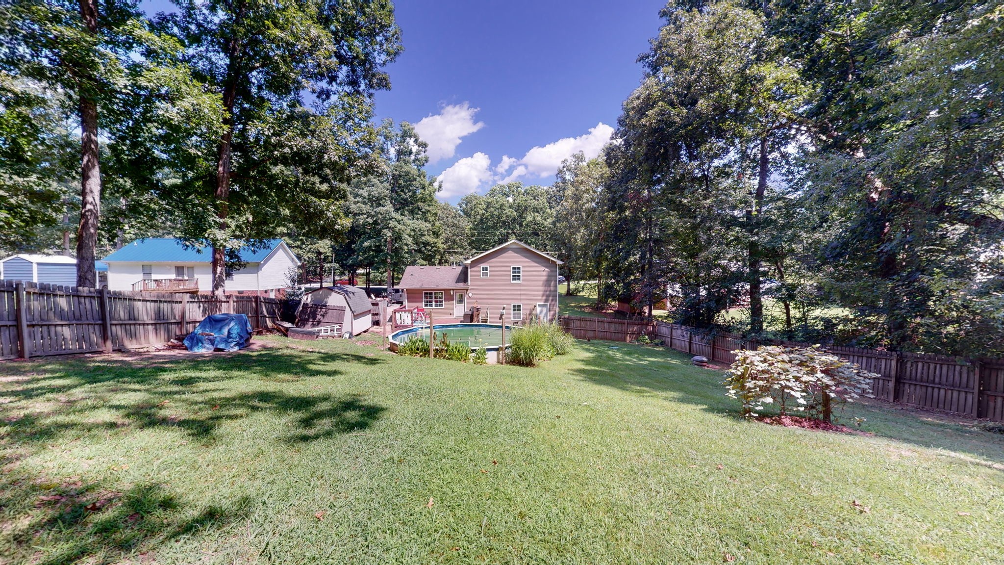 1014 Wildcat Road Dickson, TN 37055 - Photo 31 of 37 a view of a house with a big yard and large trees
