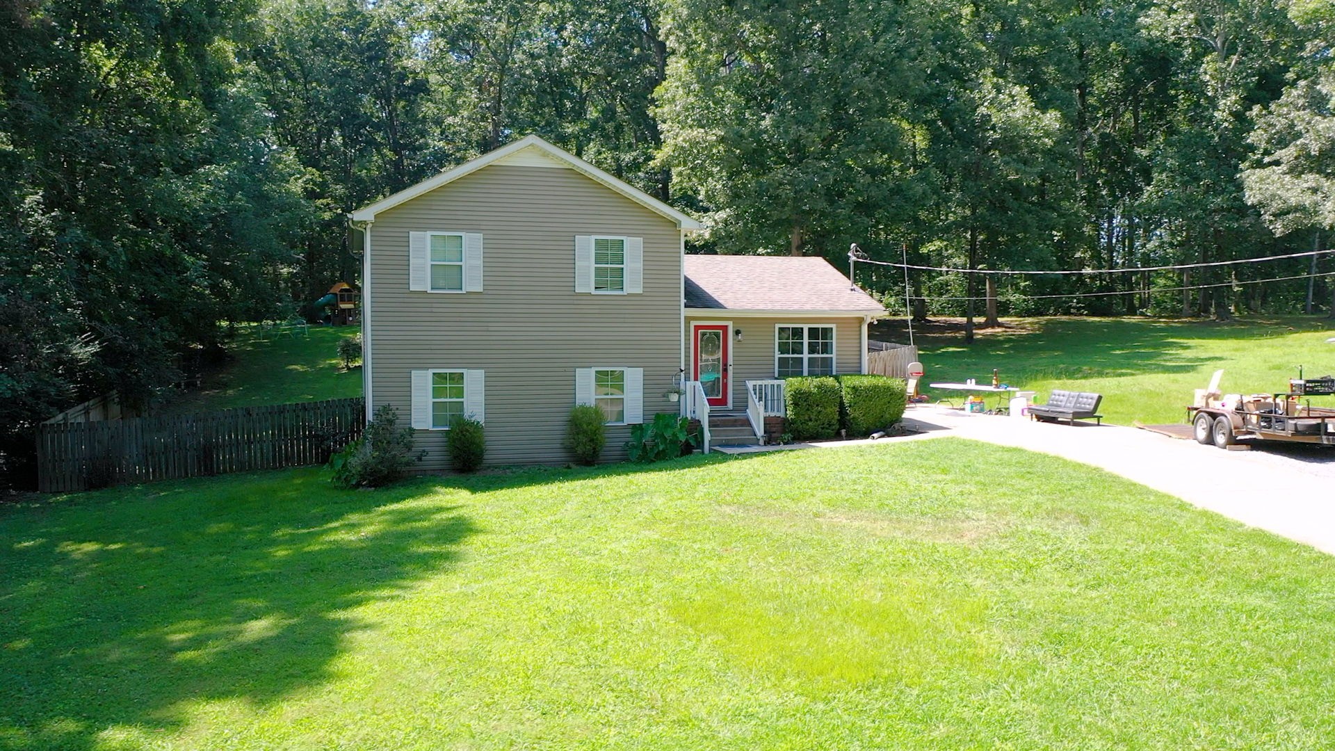 1014 Wildcat Road Dickson, TN 37055 - Photo 4 of 37 a front view of a house with yard and green space