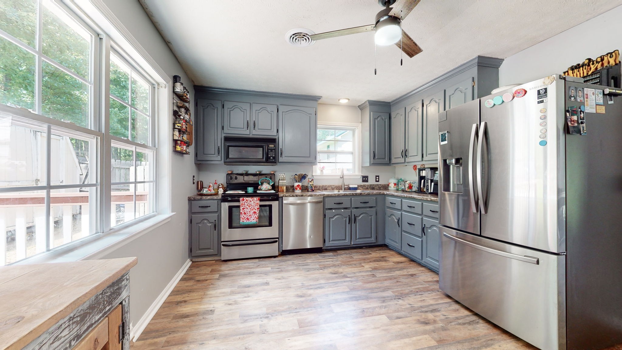 1014 Wildcat Road Dickson, TN 37055 - Photo 8 of 37 a kitchen with stainless steel appliances a refrigerator sink and microwave