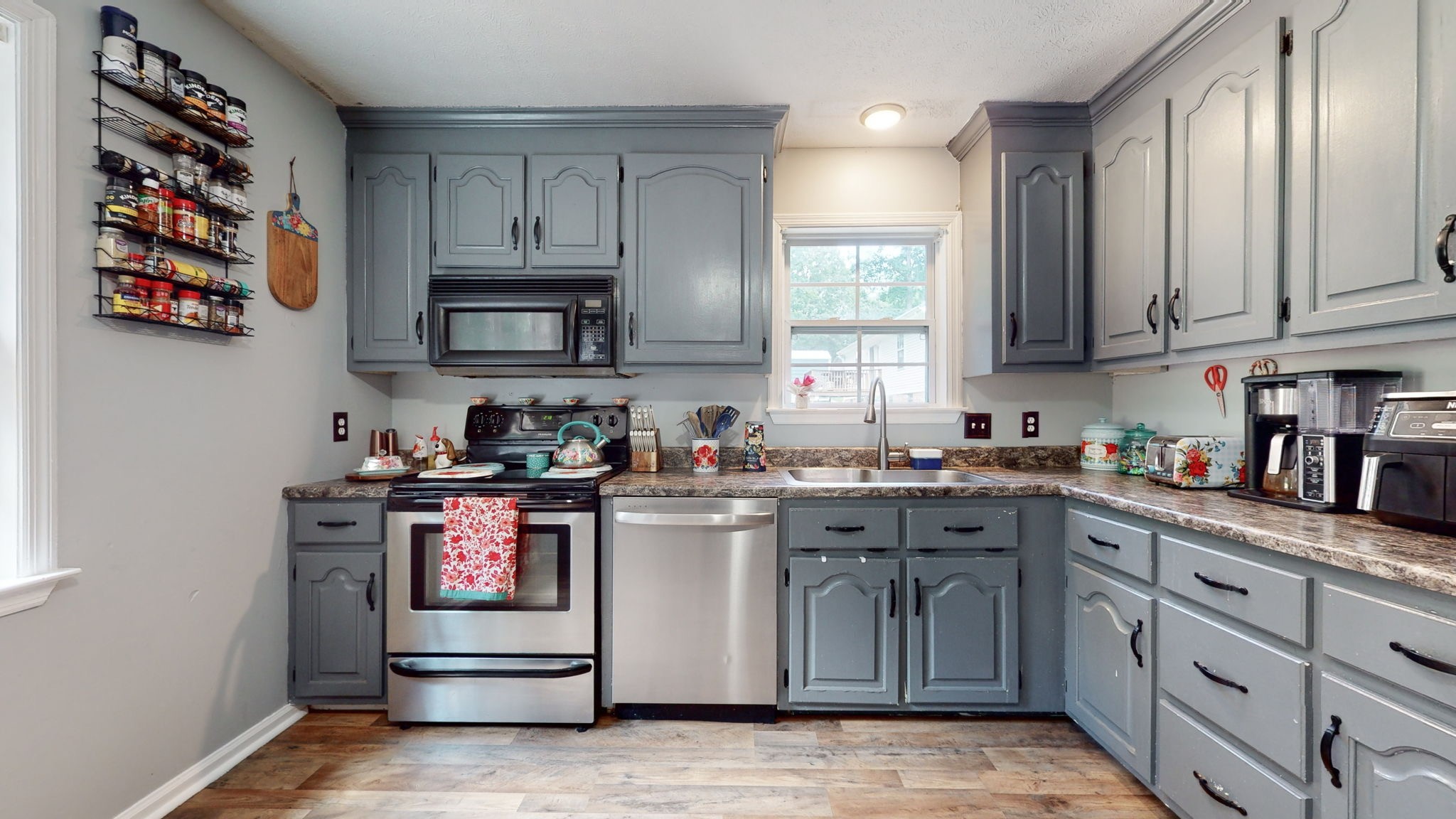 1014 Wildcat Road Dickson, TN 37055 - Photo 9 of 37 a kitchen with stainless steel appliances granite countertop a stove and cabinets