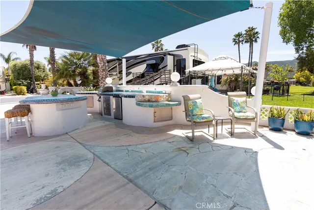 a building outdoor space with patio furniture and potted plants
