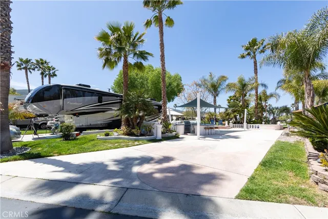 a view of a backyard with a garden and trees