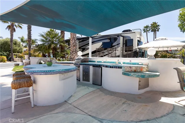 a view of a kitchen with furniture and stove