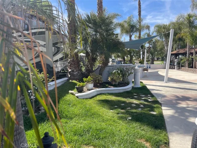 a view of a swimming pool with sitting area