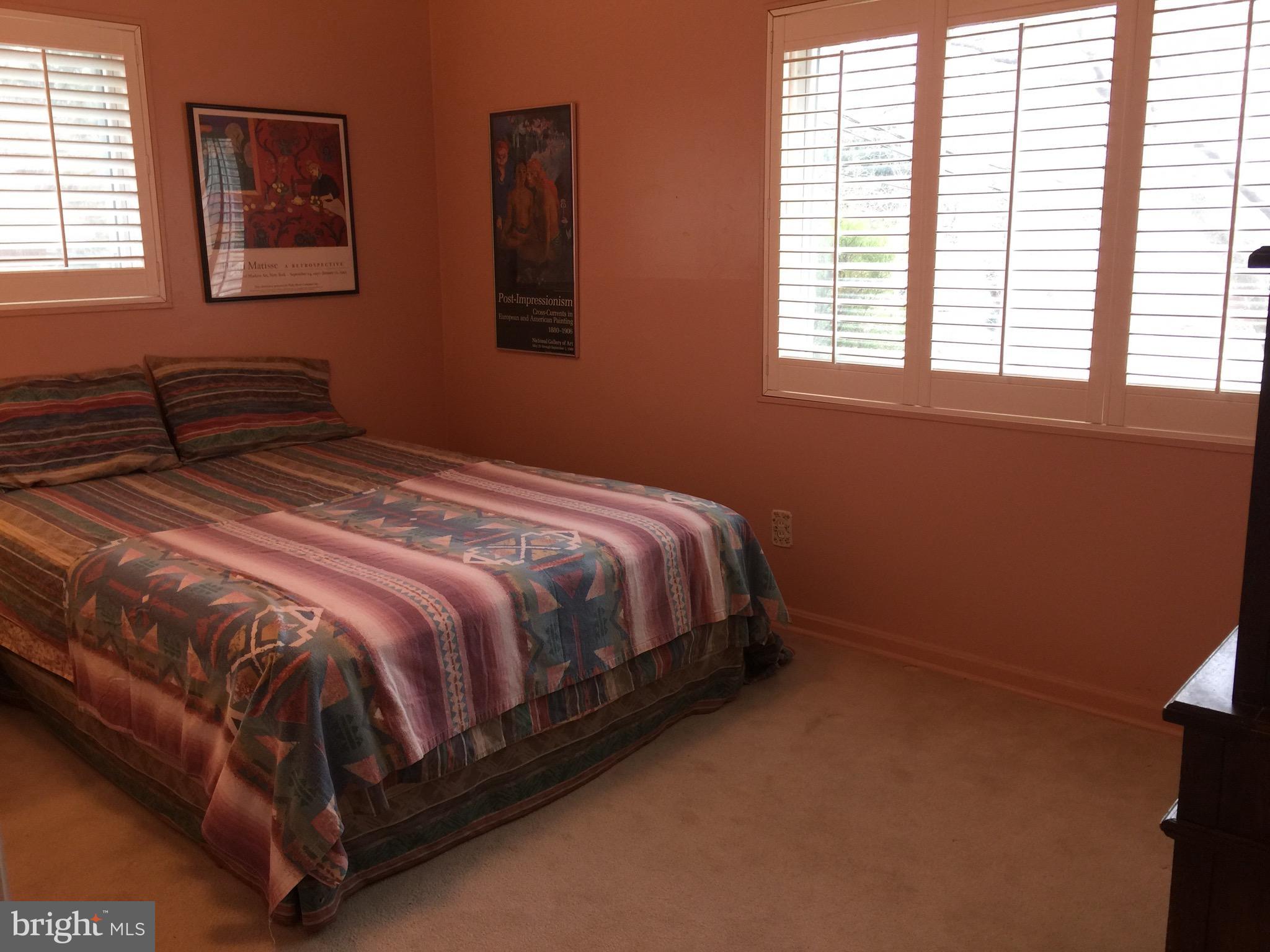 11511 Yates Street Silver Spring, MD 20902 - Photo 13 of 27 Nice sized bedroom, shutters, carpet over hardwood
