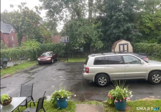a front view of a house with parking space