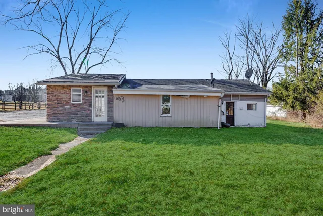 front view of a house with a yard