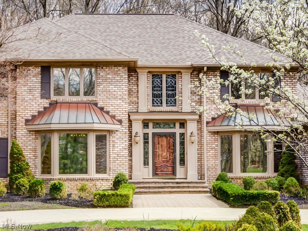 1739 Chartley Road Gates Mills, OH 44040 - Photo 2 of 25 This all brick home has two front bay windows with copper roofs in both the formal living & dining rooms.