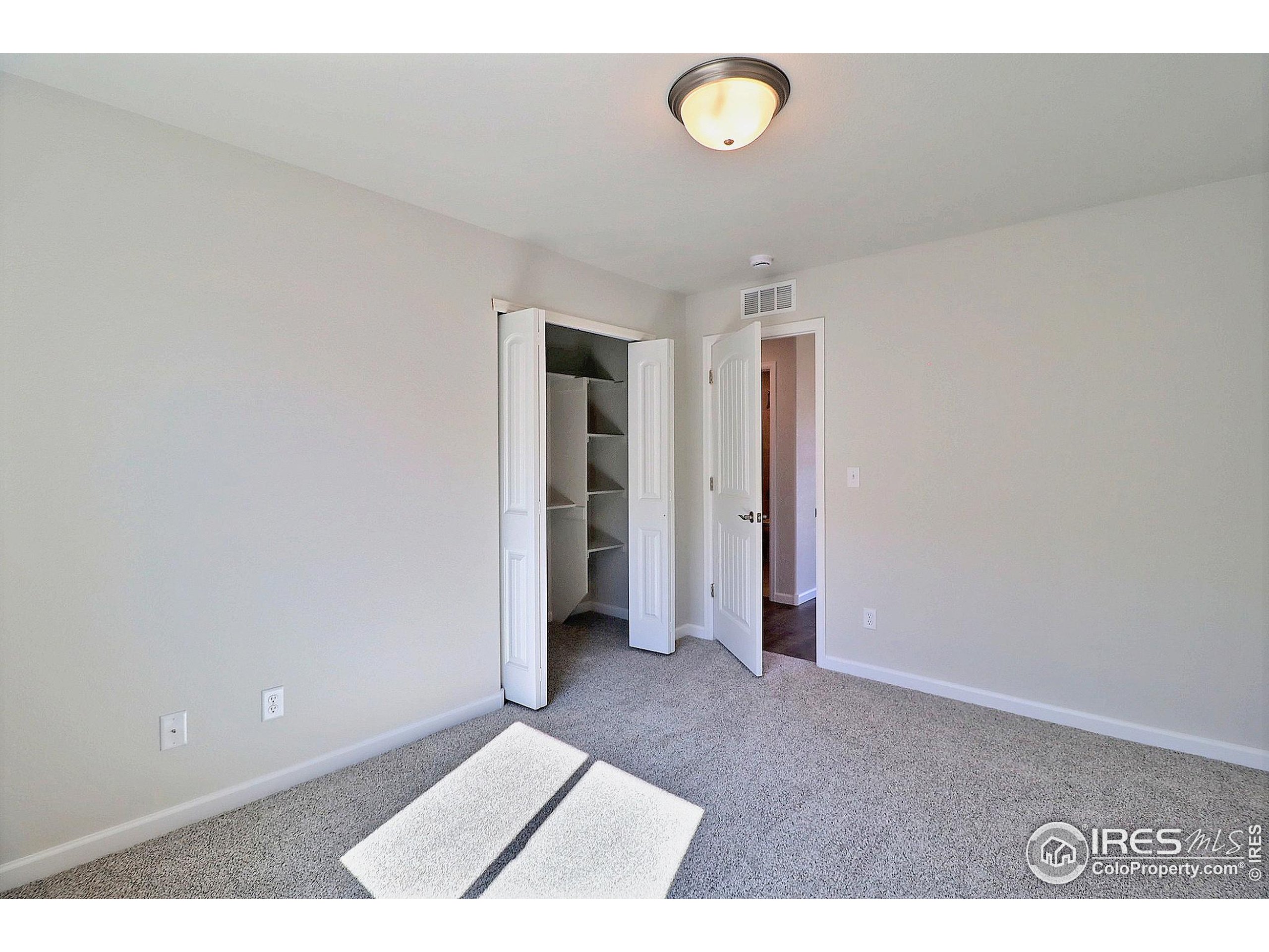 4301 Rockcress Road Evans, CO 80620 - Photo 22 of 26 a view of an empty room and window