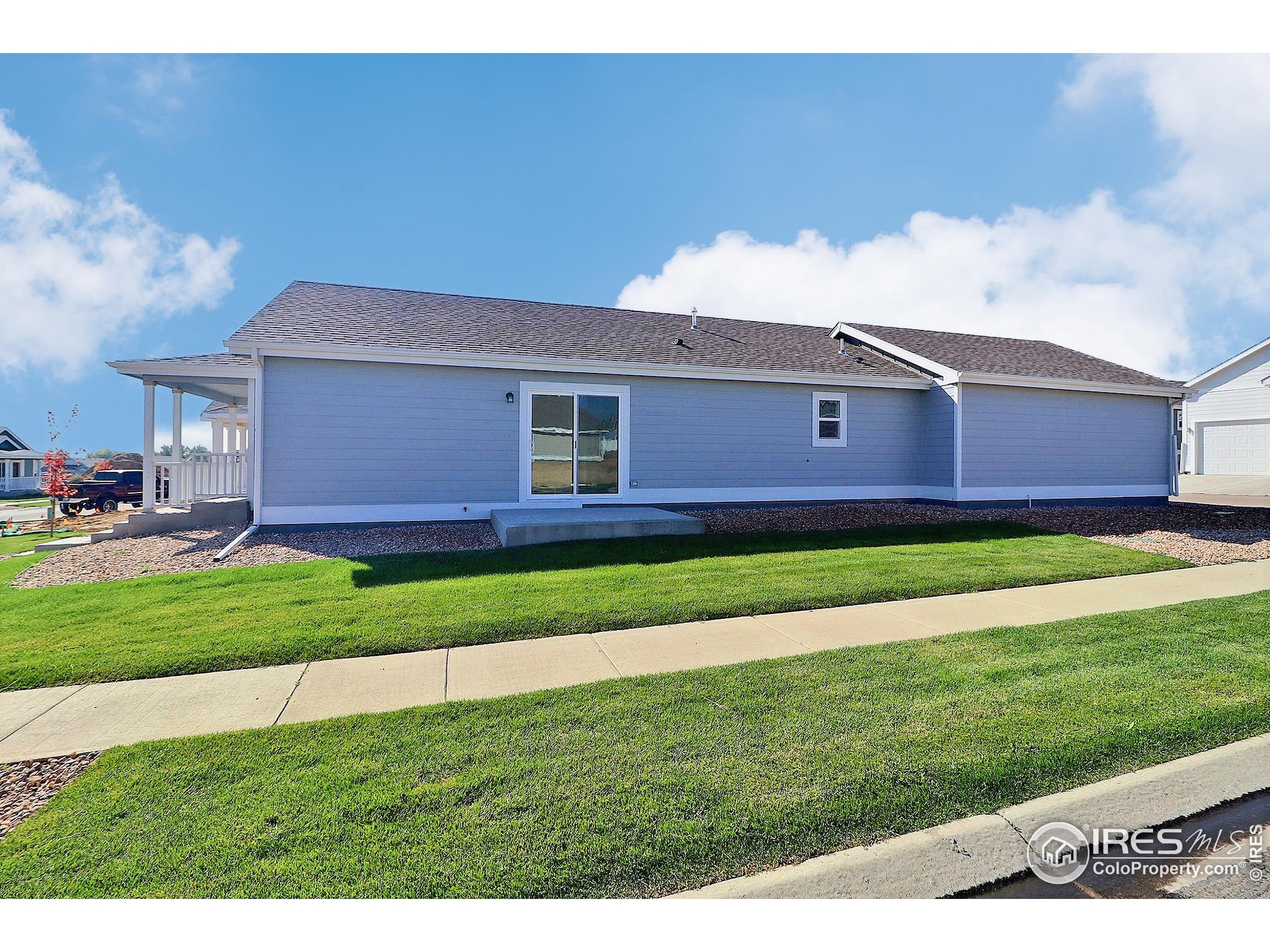 4301 Rockcress Road Evans, CO 80620 - Photo 25 of 26 a front view of a house with a yard