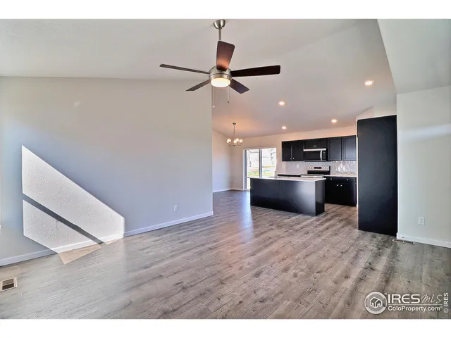 a view of kitchen with wooden floor