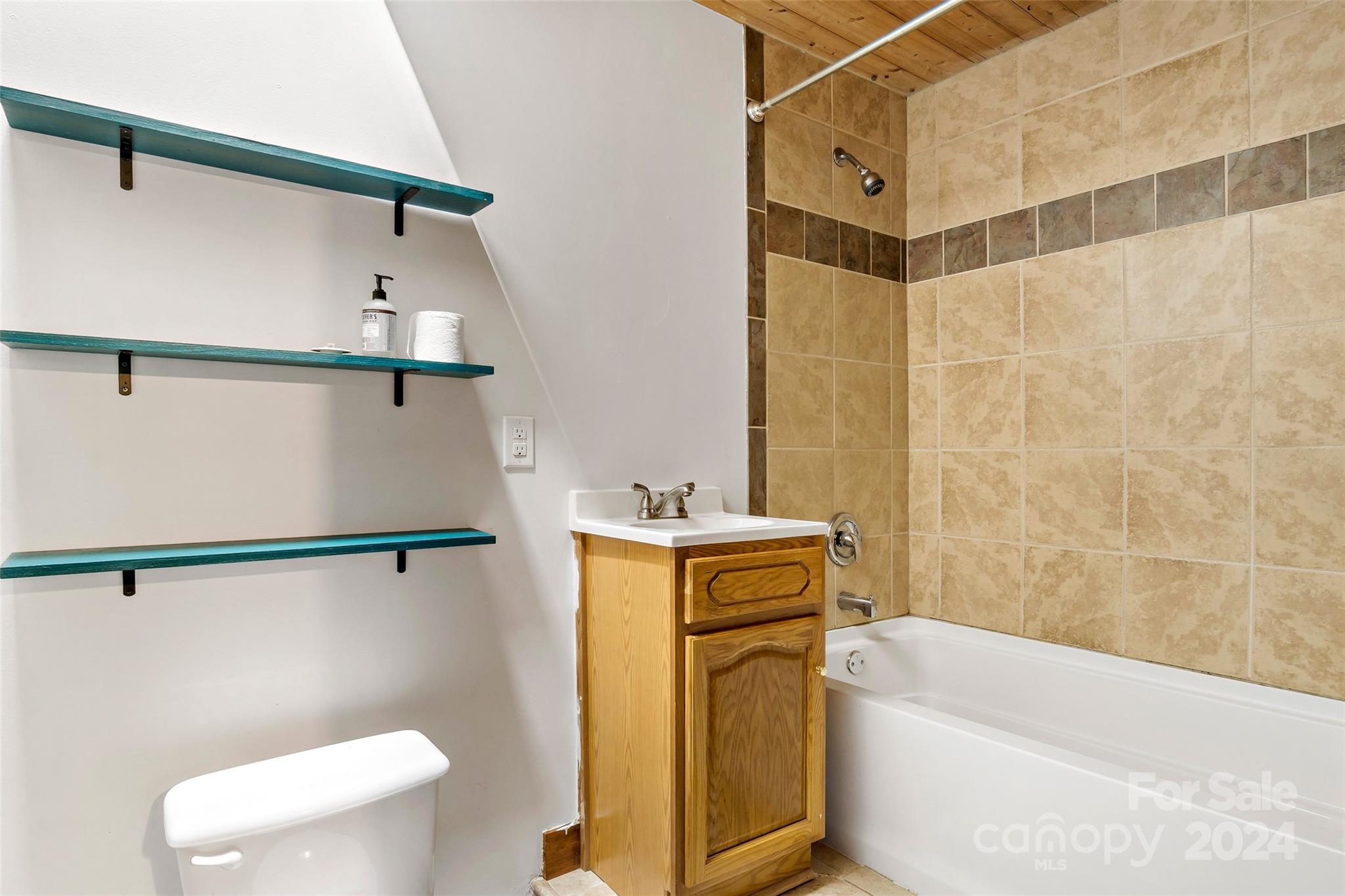 1265 Stackhouse Road Marshall, NC 28753 - Photo 20 of 34 a bathroom with a granite countertop bathtub sink and toilet