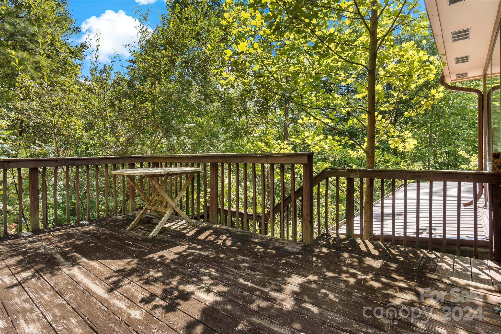 1265 Stackhouse Road Marshall, NC 28753 - Photo 22 of 34 a view of a bench in a backyard