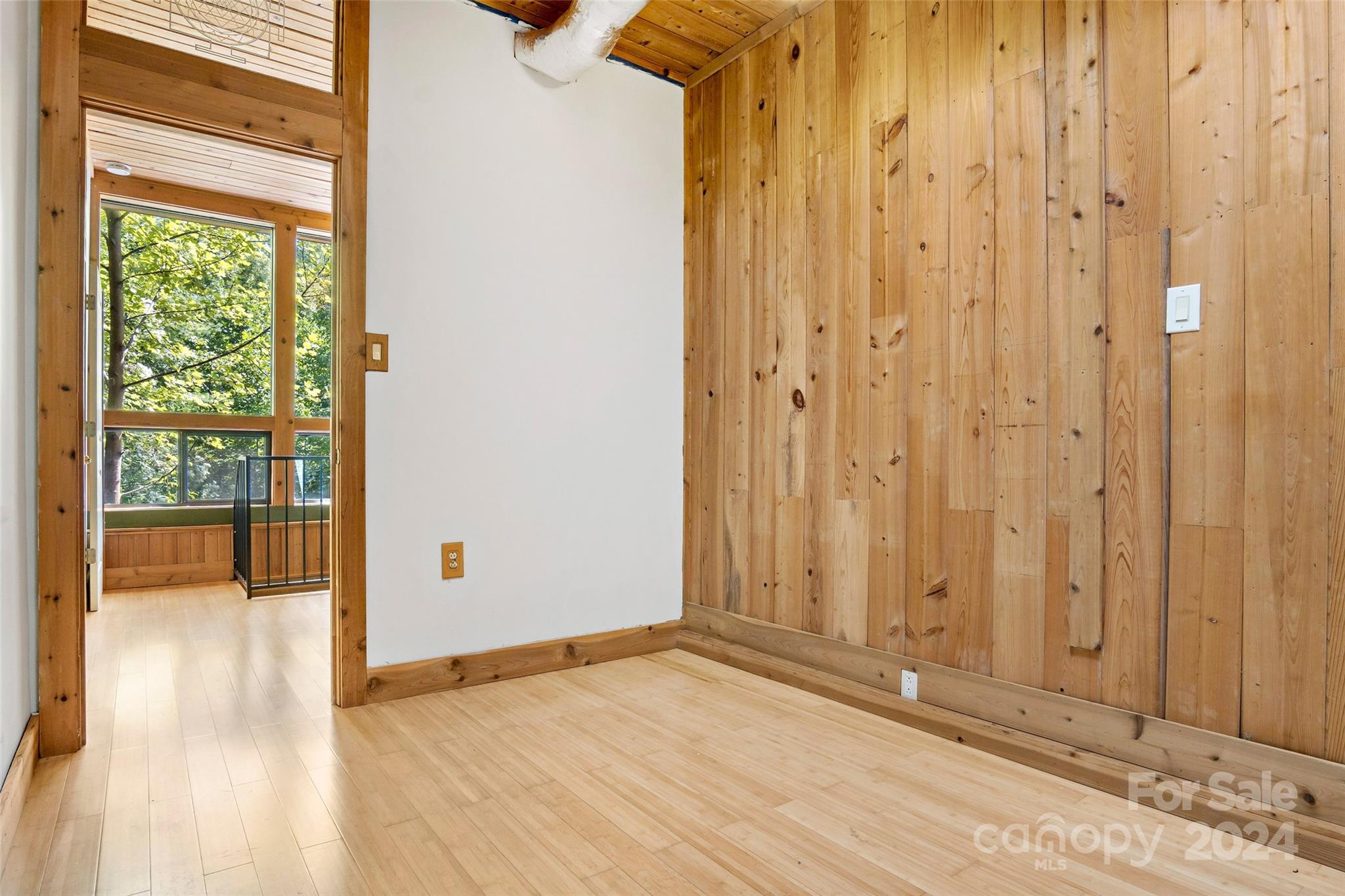 1265 Stackhouse Road Marshall, NC 28753 - Photo 25 of 34 a view of an empty room with wooden floor and a window