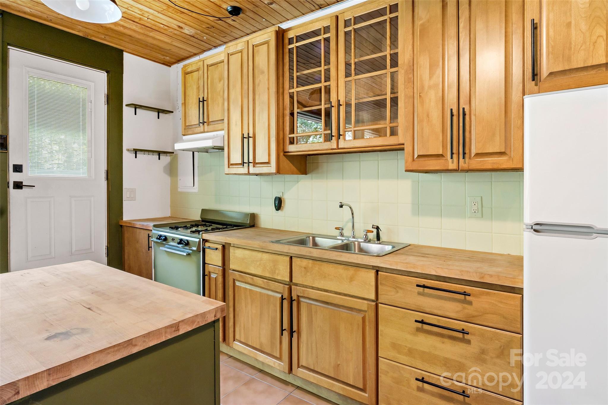 1265 Stackhouse Road Marshall, NC 28753 - Photo 9 of 34 a kitchen with stainless steel appliances granite countertop a sink and cabinets