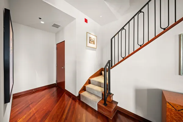 a view of entryway with wooden floor