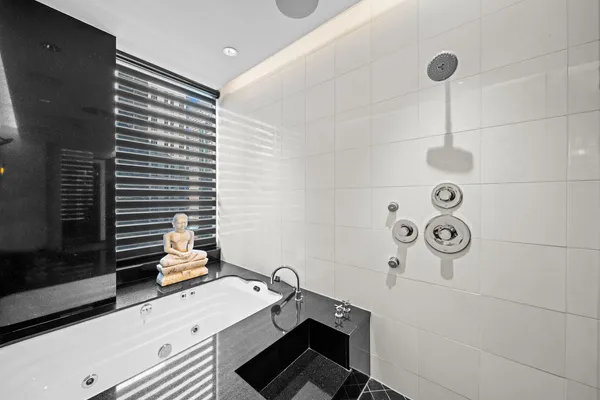 a bathroom with a sink a toilet and shower curtain
