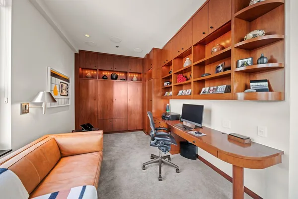 a workspace with furniture and window