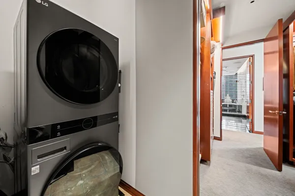 a view of a bedroom with washer and dryer