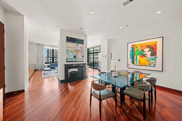a view of a dining room with furniture and wooden floor