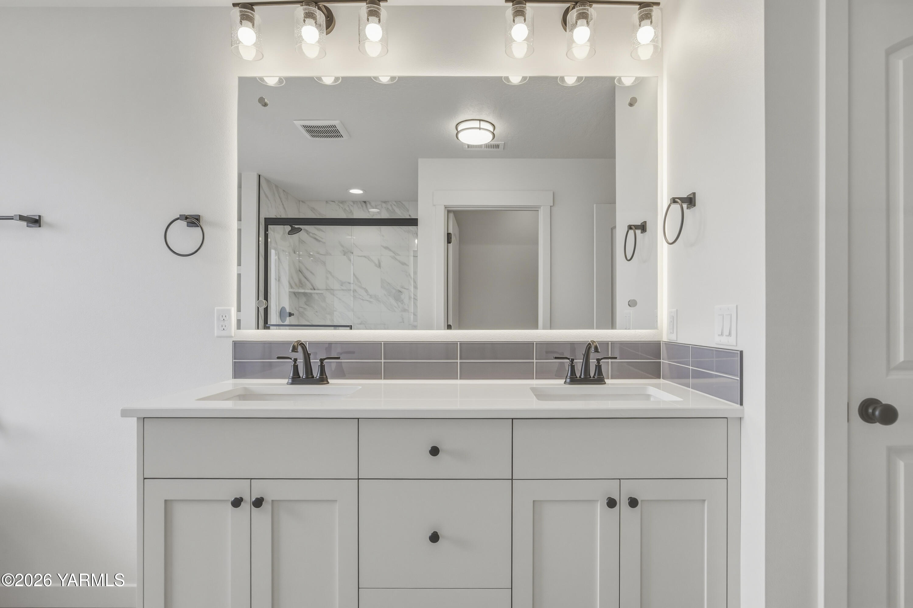 215 Packer Street Prosser, WA 99350 - Photo 23 of 45 a bathroom with a double vanity sink and a mirror