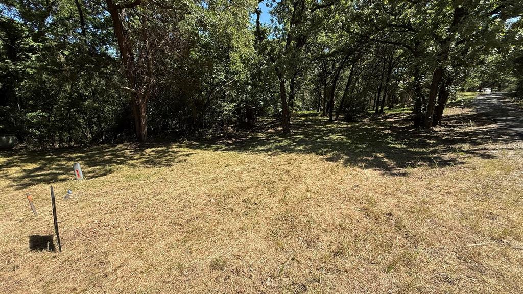 409 Spinnaker Run Oak Point, TX 75068 - Photo 17 of 19 a view of a yard covered with snow