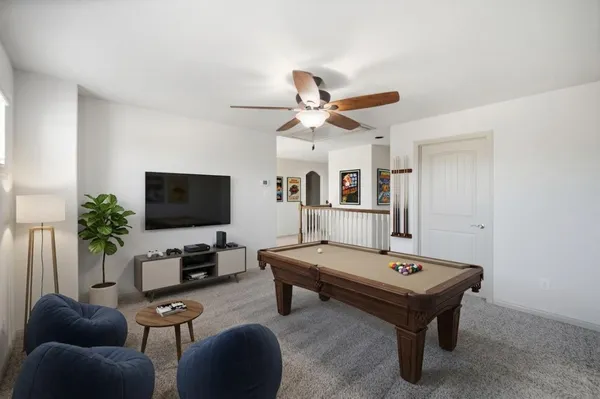 a room with furniture and a flat screen tv