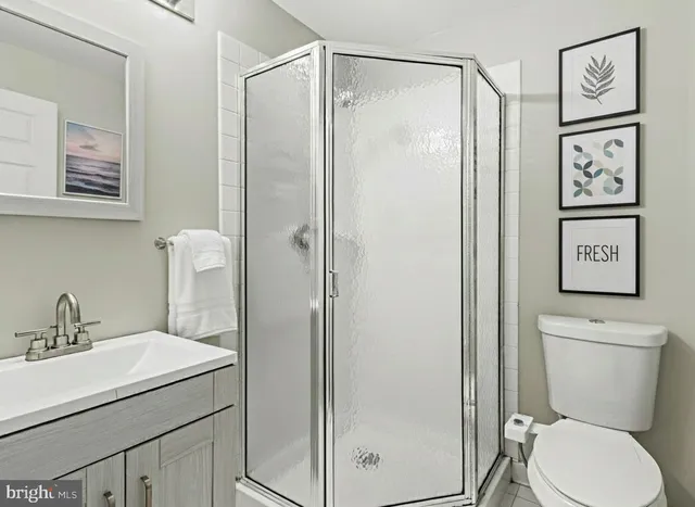 a bathroom with a toilet sink and shower