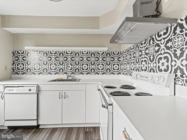 a kitchen with a cabinets and a stove top oven