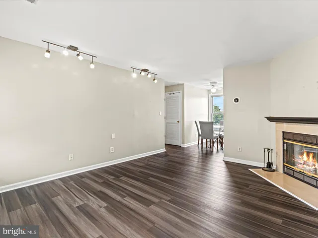 a view of livingroom with hardwood floor and a ceiling fan