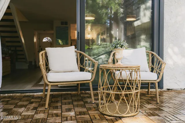 a view of a balcony with chairs