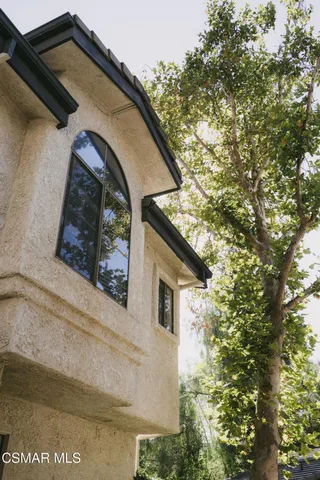 a view of a house with a small yard